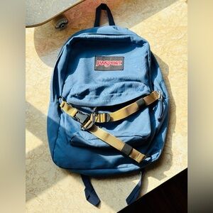 JanSport Blue Backpack with Tan Strap